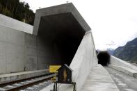 A statue of Saint Barbara, the patron saint of miners, stands in front of the northern entrances of the NEAT Gotthard Base tunnel near Erstfeld May 7, 2012. Crossing the Alps, the world's longest train tunnel should become operational at the end of 2016. The project consists of two parallel single track tunnels, each of a length of 57 km (35 miles)