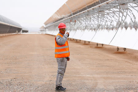 A security guard stands near the thermosolar power plant at Noor II, northeast of the city of Ouarzazate, Morocco, November 4, 2016. REUTERS/Youssef Boudlal