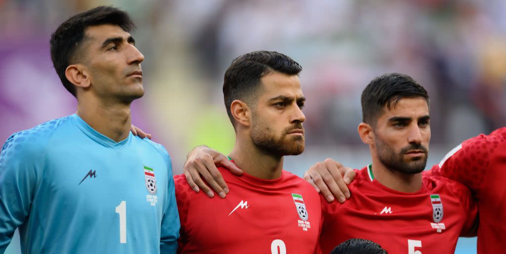 doha, qatar   november 21 l r alireza beiranvand, morteza pouraliganji and morteza pouraliganji of ir iran line up for the national anthem prior to the fifa world cup qatar 2022 group b match between england and ir iran at khalifa international stadium on november 21, 2022 in doha, qatar photo by matthias hangstgetty images