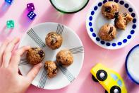 These one-bite coconut and oat cuties are just as easy to make as they are to devour. Try one batch with dried cherries and another with mini chocolate chips. It may not be a full meal, but it'll definitely keep any new parent's energy up. <a href="https://www.epicurious.com/recipes/food/views/no-bake-energy-bites-with-oats-and-dried-cherries?mbid=synd_yahoo_rss" rel="nofollow noopener" target="_blank" data-ylk="slk:See recipe.;elm:context_link;itc:0" class="link ">See recipe.</a>