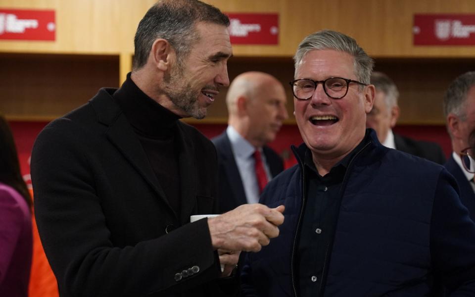 Sir Keir Starmer talks to Martin Keown, the former Arsenal football player, during a visit to St George's Park in Burton-on-Trent as Labour hold a shadow cabinet away day