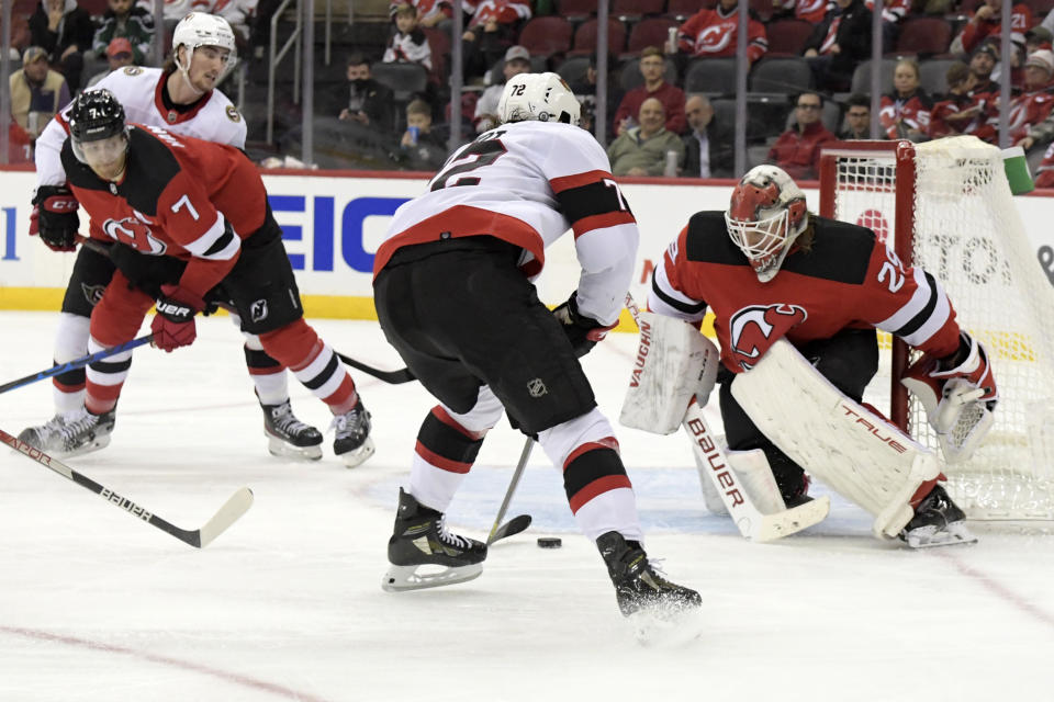 Ottawa Senators defenseman Thomas Chabot (72) skates in on New Jersey Devils goaltender Mackenzie Blackwood (29) during the second period of an NHL hockey game, Monday, Dec. 6, 2021, in Newark, N.J. (AP Photo/Bill Kostroun)