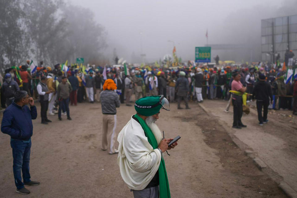 Indian farmers who have been protesting for a week to demand guaranteed crop prices wait to march to the capital near Shambhu border that divides northern Punjab and Haryana states, some 200 kilometers (120 miles) from New Delhi, India, Wednesday, Feb.21, 2024. The protesting farmers began their march last week, but their efforts to reach the city have been blocked by authorities. (AP Photo/Altaf Qadri)