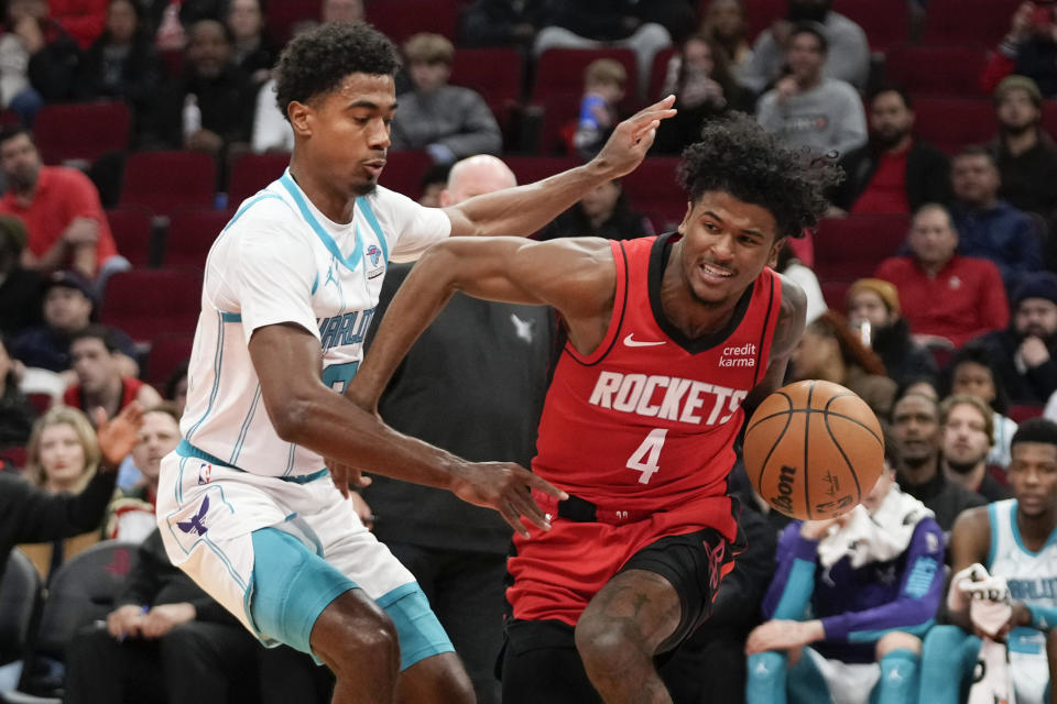 Houston Rockets guard Jalen Green (4) drives past Charlotte Hornets guard Theo Maledon during the first half of an NBA basketball game, Wednesday, Nov. 1, 2023, in Houston. (AP Photo/Eric Christian Smith)