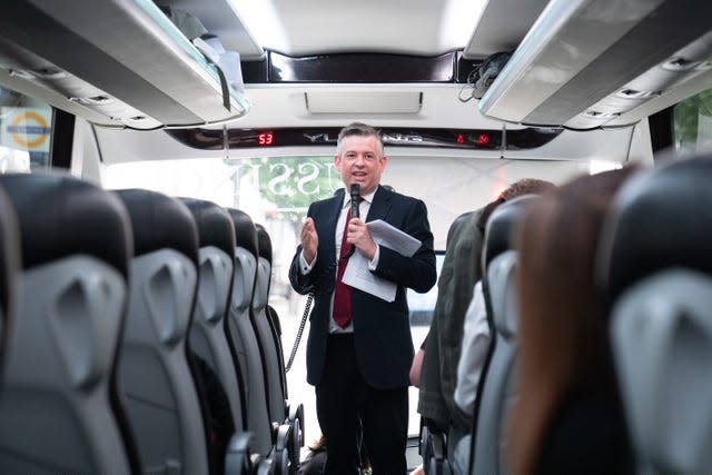 Shadow paymaster general Jonathan Ashworth talks to journalists on the Labour Party battle bus