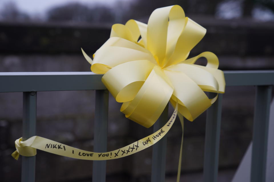 A yellow ribbon with a message of hope written on it, is tied to a bridge over the River Wyre in St Michael's on Wyre, Lancashire, as police continue their search for missing woman Nicola Bulley, 45, who was last seen on the morning of Friday January 27, when she was spotted walking her dog on a footpath by the nearby River Wyre. Picture date: Sunday February 12, 2023. (Photo by Peter Byrne/PA Images via Getty Images)