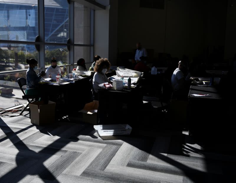 Employees of the Fulton County Board of Registration and Elections process ballots in Atlanta