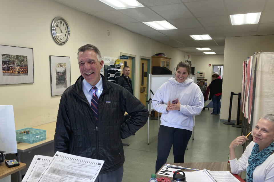 Vermont Republican Gov. Phil Scott prepares to cast his ballot at the Town Clerk's office in his home town of Berlin, Vt., on Tuesday Nov. 8, 2022. Scott's first ballot was rejected after he had incorrectly filled out a portion of it. He was given a new ballot, which after his filled it out, he then successfully fed into the machine. Scott is seeking his fourth two-year term as governor of deep blue Vermont. (AP Photo/Wilson Ring)