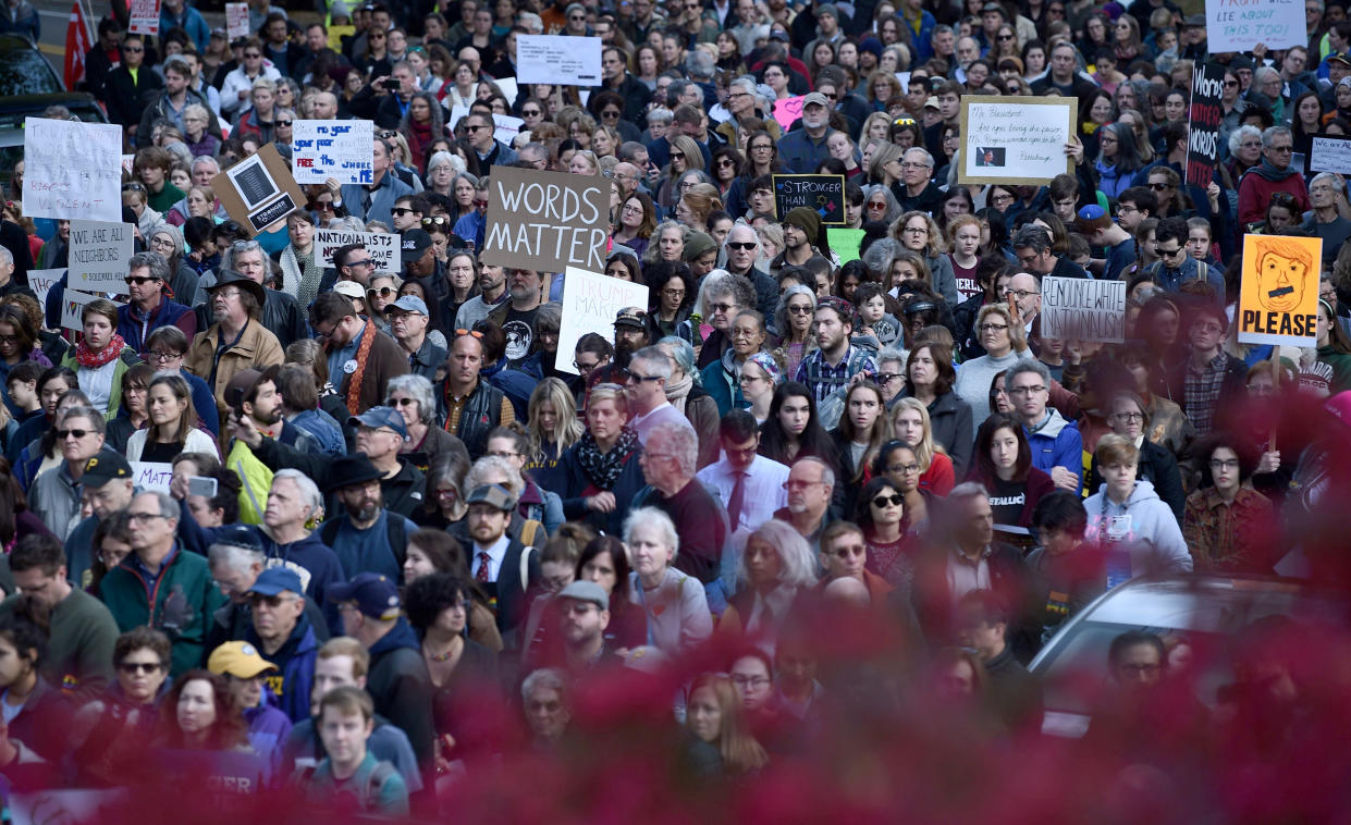 People protesting President Trump gather near the Tree of Life Congregation