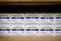 FILE - Boxes of the drug mifepristone line a shelf at the West Alabama Women's Center in Tuscaloosa, Ala., on March 16, 2022. The Supreme Court's ruling allowing states to regulate abortion has set off a mad travel scramble across the country to direct patients to states that still allow the procedure. (AP Photo/Allen G. Breed, File)