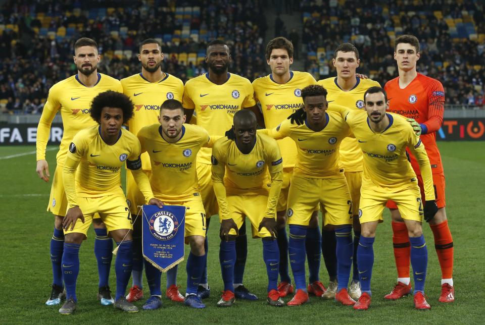 Chelsea starting players pose for a team photo at the beginning of the Europa League round of 16, second leg soccer match between Dynamo Kiev and Chelsea at the Olympiyskiy stadium in Kiev, Ukraine, Thursday, March 14, 2019. (AP Photo/Efrem Lukatsky)