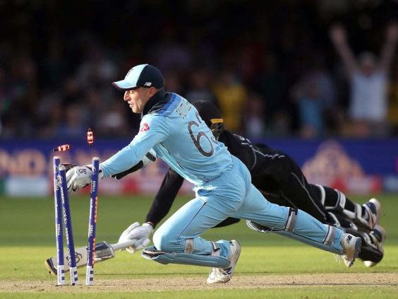 Jos Buttler breaking the bails to clinch England’s World Cup win (PA)