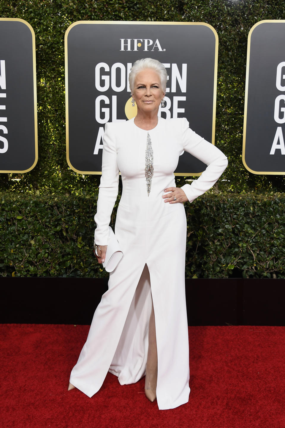 <p>Sexy at 60! Curtis looked radiant in a white Alexander McQueen gown.<br>Image via Getty Images. </p>