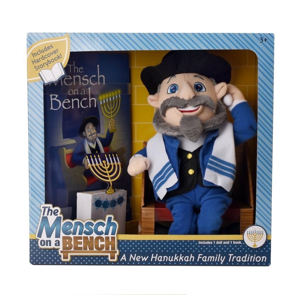 After Neal Hoffman's son Jake asked him for an Elf on the Shelf, the Jewish father decided to create&nbsp;<a href="https://themenschonabench.com/?v=7516fd43adaa" target="_blank">The Mensch on a Bench</a>&nbsp;-- a storybook and mensch doll -- to teach&nbsp;his children about&nbsp;Hanukkah in a fun way. Moshe the Mensch holds the shamash candle and watches over the menorah.