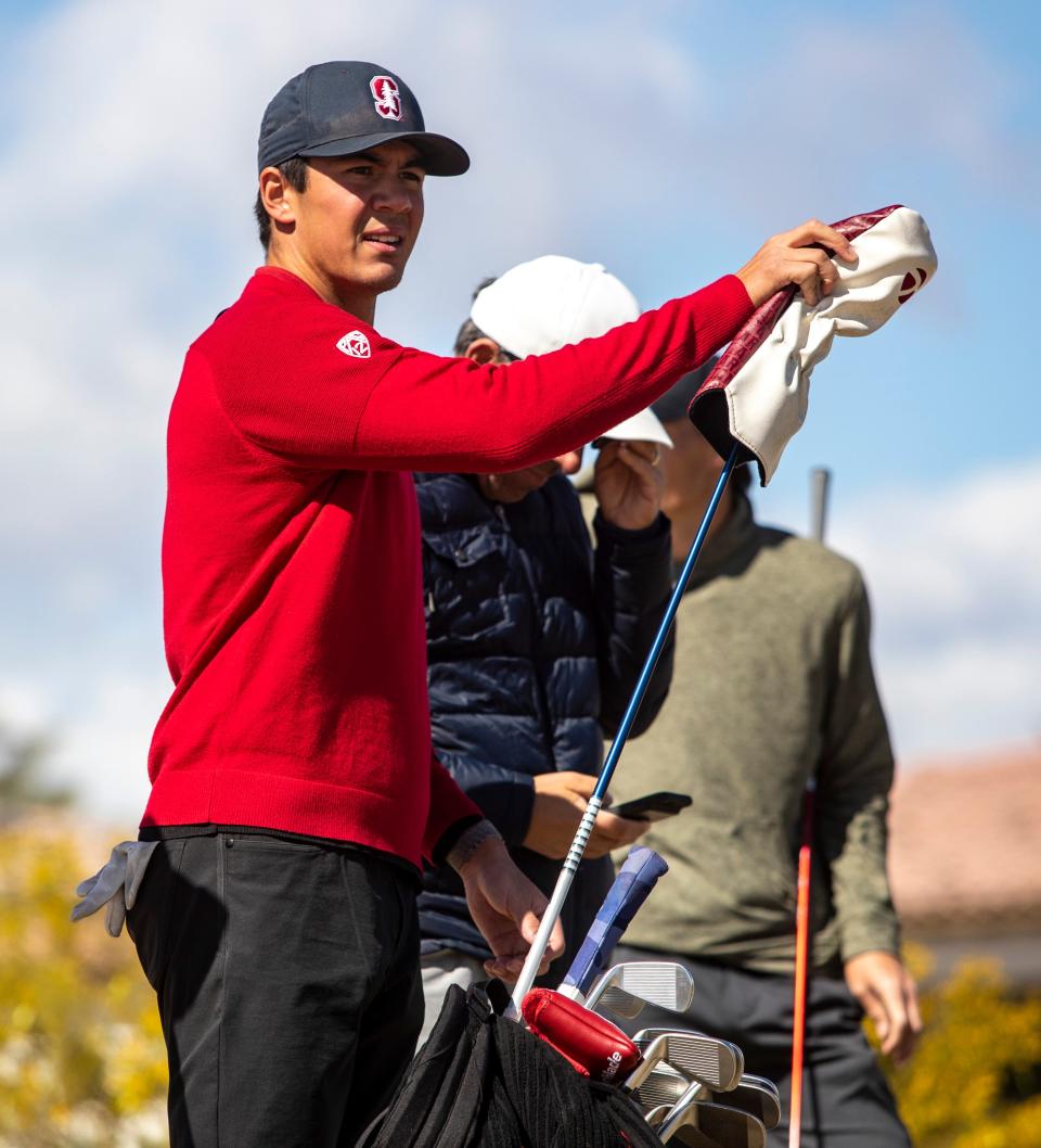 Stanford's Michael Thorbjornsen grabs a club while getting ready to tee off on hole two during the final round of the Prestige college golf tournament on the Norman Course of PGA West in La Quinta, Calif., Wednesday, Feb. 22, 2023. 