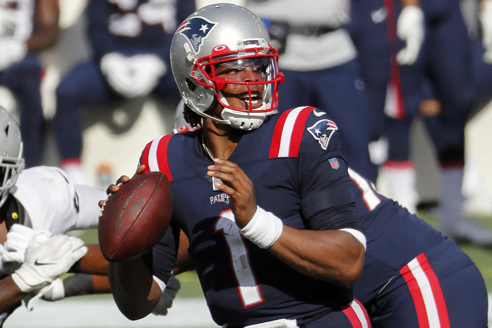 New England Patriots quarterback Cam Newton looks to pass against the Las Vegas Raiders during an NFL football game at Gillette Stadium, Sunday, Sept. 27, 2020 in Foxborough, Mass. Maybe the third time will actually bring a kickoff between for the Denver Broncos and New England Patriots. After having their original Week 5 matchup twice postponed because of a mini outbreak of coronavirus cases on the Patriots that saw four players including quarterback Cam Newton and reigning Defensive Player of the Year Stephon Gilmore test positive, the teams are hopeful they will finally meet this week. (AP Photo/Winslow Townson)