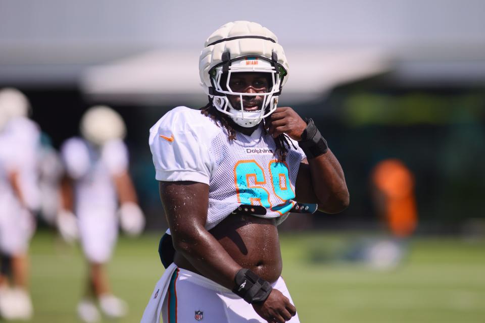 Center Ireland Brown is trying to make the Dolphins roster and he's using his Guardian helmet to help.