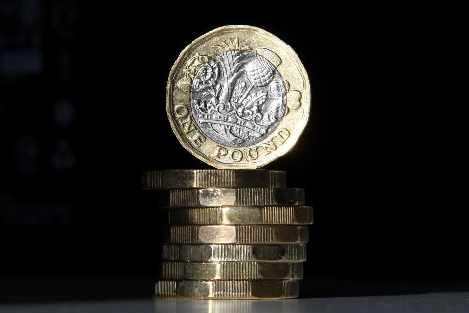 British one pound sterling coins are arranged for a photograph in central London on October 5, 2017. The British pound was under pressure on October 5, 2017, falling against the euro and the dollar, due to renewed political uncertainty in the United Kingdom after Prime Minister Theresa May's speech at the Conservative Party annual conference. / AFP PHOTO / Daniel SORABJI        (Photo credit should read DANIEL SORABJI/AFP/Getty Images)