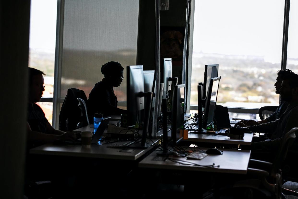 Content moderators like these workers make decisions about online communities based on company dictates. <a href="https://www.gettyimages.com/detail/news-photo/content-moderators-work-at-a-facebook-office-in-austin-news-photo/1142321813" rel="nofollow noopener" target="_blank" data-ylk="slk:Ilana Panich-Linsman for The Washington Post via Getty Images;elm:context_link;itc:0;sec:content-canvas" class="link ">Ilana Panich-Linsman for The Washington Post via Getty Images</a>