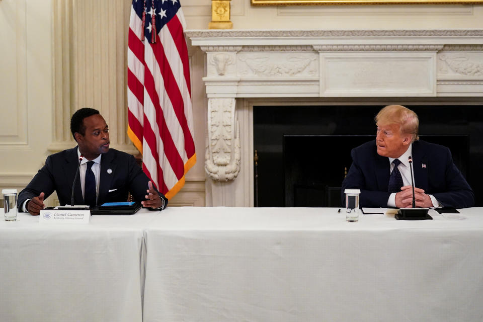 Cameron, shown here with President Donald Trump, has said his challenges to Beshear's coronavirus orders would be "unnecessary" if the governor would seek input from his office. (Photo: Kevin Lamarque / Reuters)