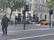 Police at the scene after a car collided with the gates of Downing Street, in London, Thursday May 25, 2023. Police say a car has collided with the gates of Downing Street in central London, where the British prime minister’s home and offices are located. The Metropolitan Police force says there are no reports of injuries. Police said a man was arrested at the scene on suspicion of criminal damage and dangerous driving. It was not immediately clear whether the crash was deliberate. (Ben Hatton/PA via AP)