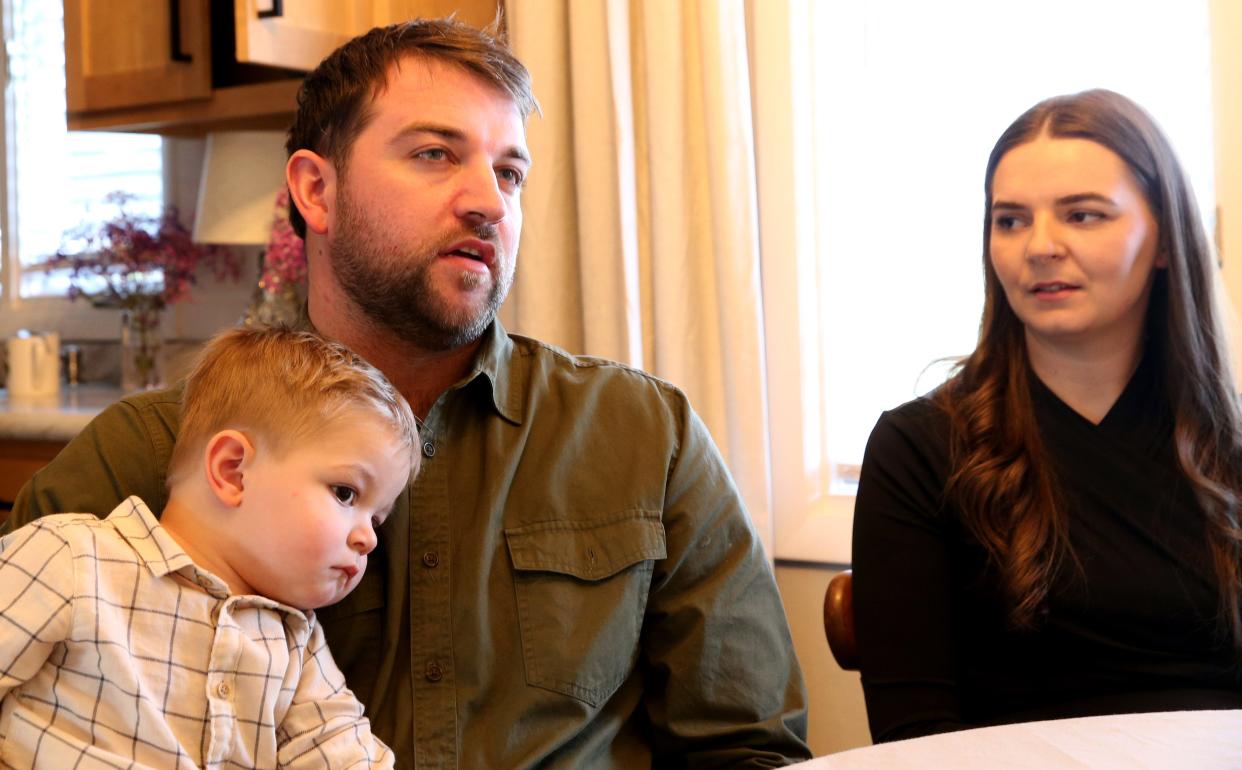 Vitalii and Daniela Shobei sit with their son, Lucas, and talk about their native Ukraine in their rented house in Goshen on Nov. 10, 2023.