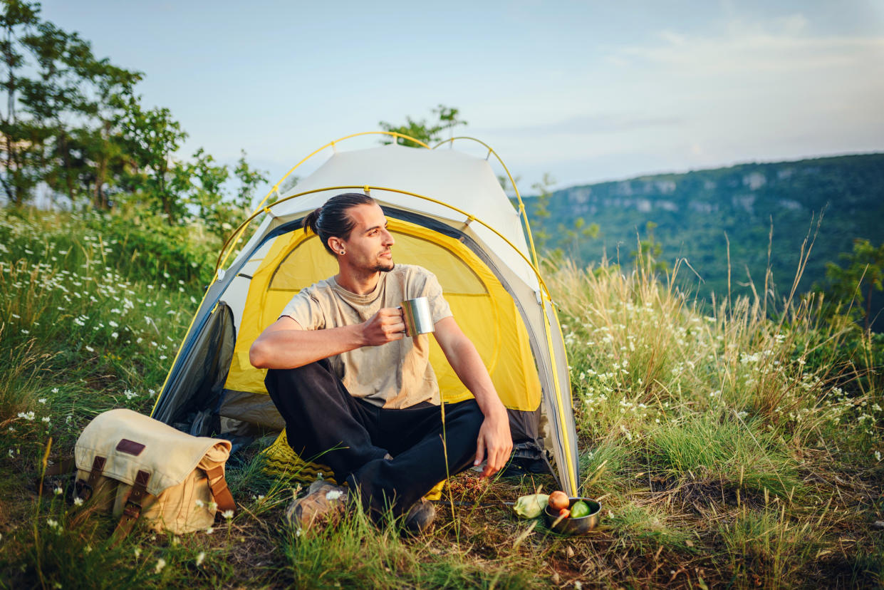  Spring camping tips: man camping. 