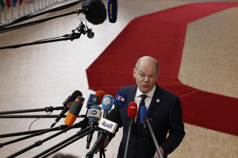 Germany's Chancellor Olaf Scholz speaks with the media as he arrives for an EU Summit in Brussels, Thursday, March 21, 2024. European Union leaders are gathering to consider new ways to help boost arms and ammunition production for Ukraine. Leaders will also discuss in Thursday's summit the war in Gaza amid deep concern about Israeli plans to launch a ground offensive in the city of Rafah. (AP Photo/Omar Havana)