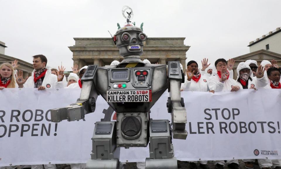 People take part in a demonstration as part of the campaign ‘Stop Killer Robots’ organised by German NGO ‘Facing Finance’ to ban what they call killer robots (DPA/AFP via Getty Images)