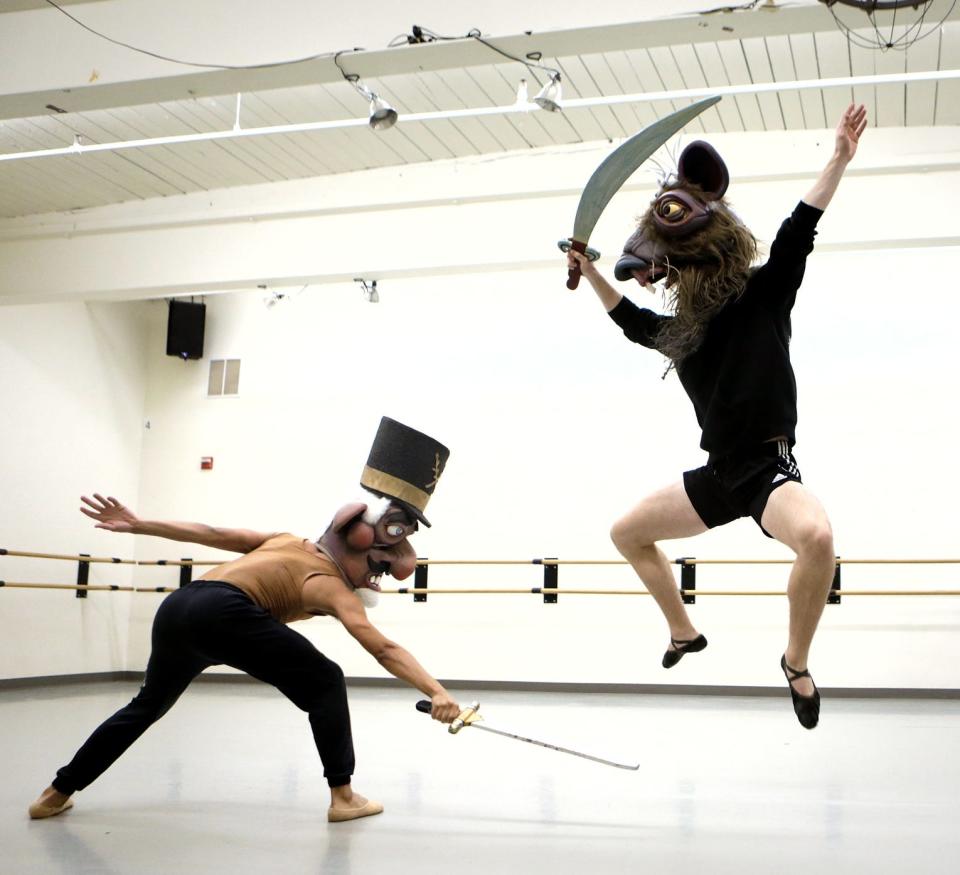 Festival Ballet dancers Kobe Atwood Courtney (as the Nutcracker) and Andrew Playford (as the Rat King) work through the choreography of the battle scene wearing the head pieces designed by Big Nazo during a rehearsal of "The Nutcracker" in 2021.