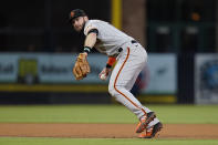 San Francisco Giants third baseman Evan Longoria throws to first for the out on San Diego Padres' Eric Hosmer during the fourth inning of a baseball game Wednesday, Sept. 22, 2021, in San Diego. (AP Photo/Gregory Bull)