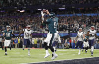 FILE - In this Feb. 4, 2018, file photo, Philadelphia Eagles' Nick Foles catches a touchdown pass during the first half of the NFL Super Bowl 52 football game against the New England Patriots, in Minneapolis. Rookie running back Corey Clement took the snap out of shotgun formation, rolled to his left and pitched the ball to third-string tight end Trey Burton, who caught it coming off the end, ran a few steps and floated a pass to backup quarterback Nick Foles in the end zone for a touchdown. Facing the mighty New England Patriots on the NFL's biggest stage, Philadelphia Eagles coach Doug Pederson's decision to try a trick play on a fourth down late in the first half of Super Bowl 52 will be remembered as one of the gutsiest calls in sports history. (AP Photo/Jeff Roberson, File)