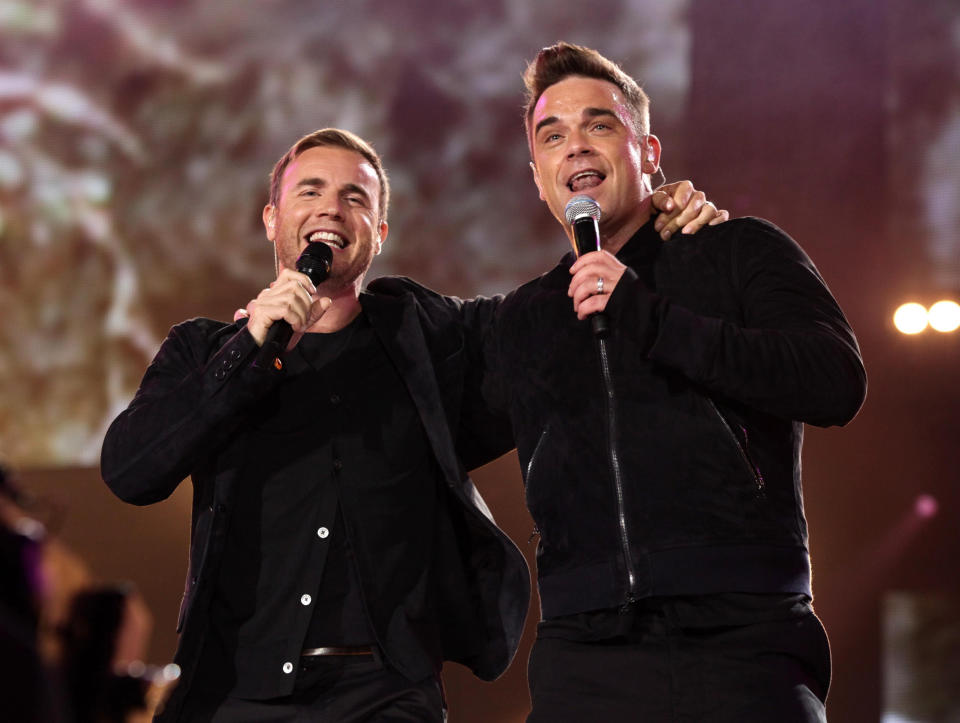 Robbie Williams (right) and Gary Barlow performing at the Help For Heroes Concert at Twickenham Stadium, south west London.