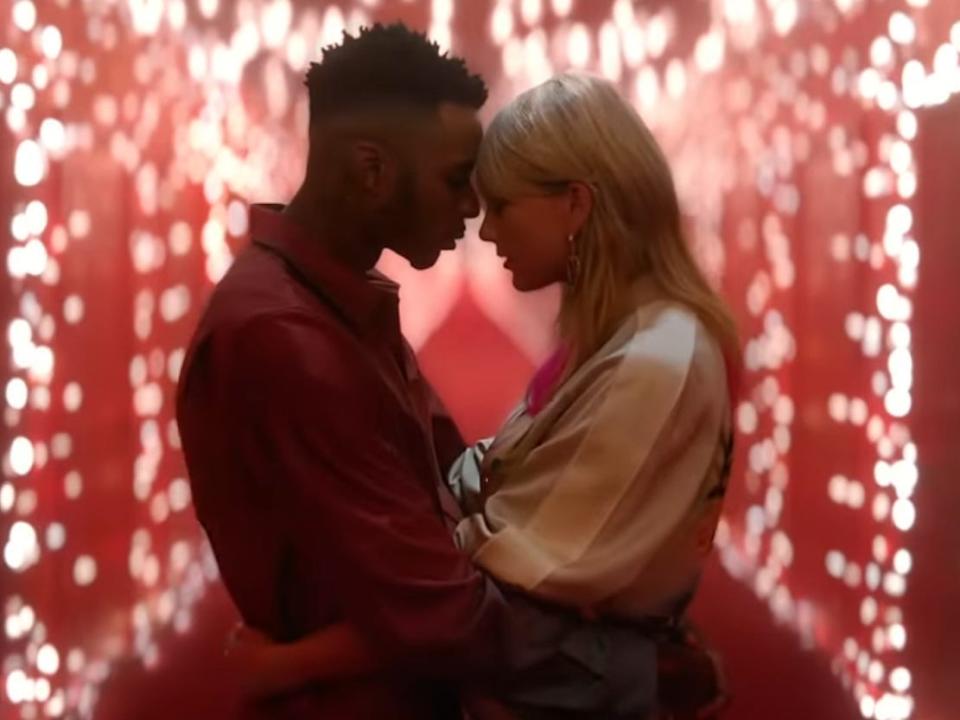 Christian Owens and Taylor Swift in the music video for "Lover."