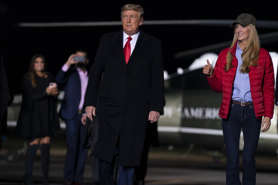 President Donald Trump arrives to speak at a campaign rally for Sen. Kelly Loeffler, R-Ga., right, and David Perdue at Dalton Regional Airport, Monday, Jan. 4, 2021, in Dalton, Ga. (AP Photo/Evan Vucci)