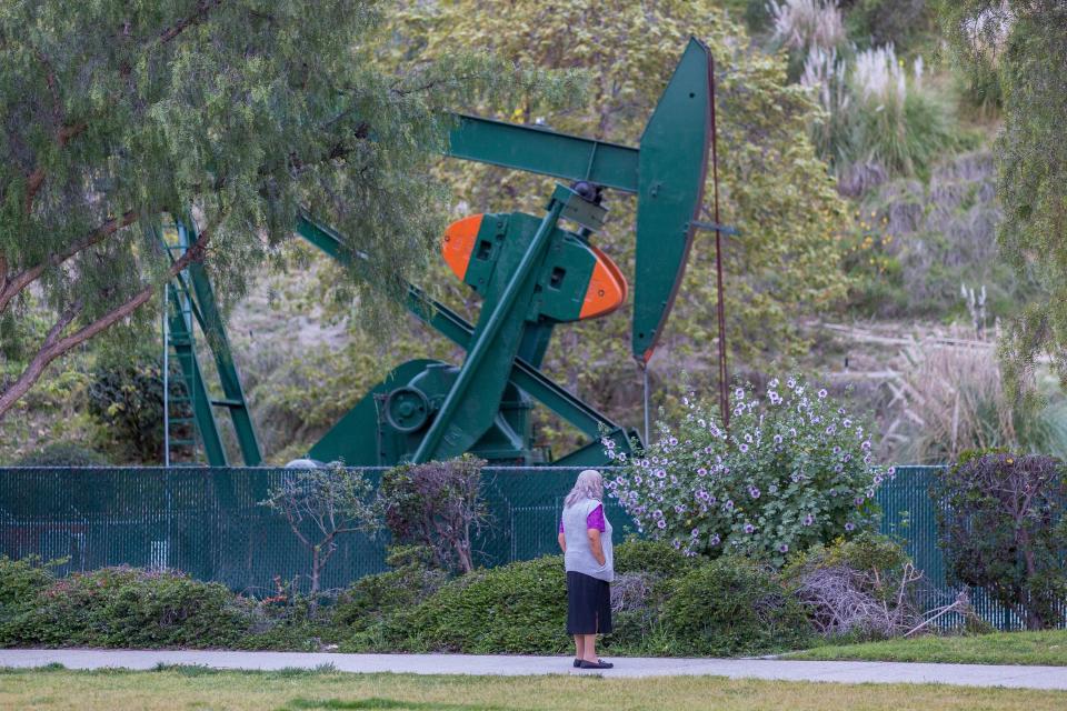 Pump jacks draw crude oil from the Long Beach Oil Field under Discovery Well Park in Signal Hill, California, last March.  (Photo: DAVID MCNEW via Getty Images)