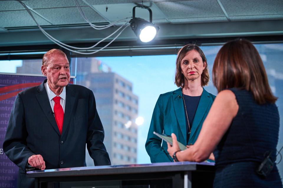 Candidates for  Arizona Superintendent of Public Instruction Tom Horne (R) (left) and Kathy Hoffman (D) (middle) participate in a debate moderated by Elvia Diaz, the editor page senior director to The Arizona Republic, in The Republic's studio on Sept. 28, 2022, in Phoenix.