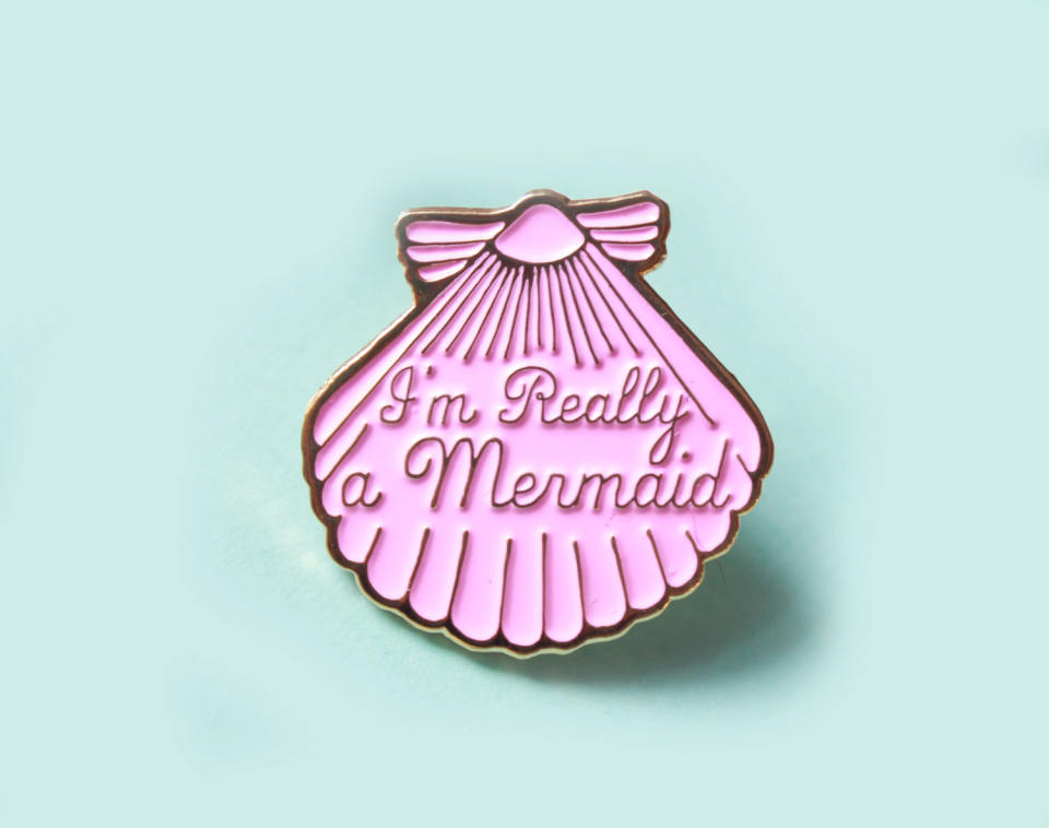 Mermaid&nbsp;Shell Enamel Pin, $8.50, <a href="https://www.etsy.com/listing/398673121/mermaid-pink-shell-enamel-pin-gifts-for?ga_order=most_relevant&amp;ga_search_type=all&amp;ga_view_type=gallery&amp;ga_search_query=mermaid&amp;ref=sr_gallery_13" target="_blank">Etsy</a>