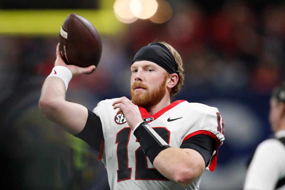 Georgia quarterback Brock Vandagriff (12) warms up before the start of the SEC Championship game against Alabama at Mercedes-Benz Stadium in Atlanta, on Saturday, Dec. 2, 2023. Credit: Joshua L. Jones-USA TODAY NETWORK