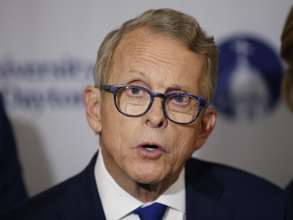 Ohio Attorney General and Republican gubernatorial candidate Mike DeWine speaks with reporters in the spin room following a debate against Ohio Democratic gubernatorial candidate Richard Cordray at the University of Dayton Wednesday, Sept. 19, 2018, in Dayton, Ohio. (AP Photo/Gary Landers)