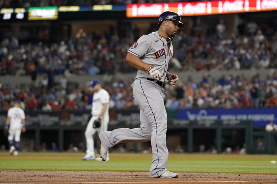 Houston Astros' Jose Abreu rounds the bases after hitting a grand slam off of Texas Rangers starting pitcher Max Scherzer, center rear, in the third inning of a baseball game, Wednesday, Sept. 6, 2023, in Arlington, Texas. (AP Photo/Tony Gutierrez)