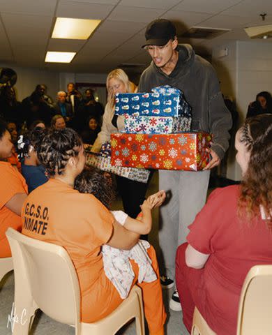 <p>Michael Cummings</p> Kyle Kuzma visits female inmates in Flint, Michigan