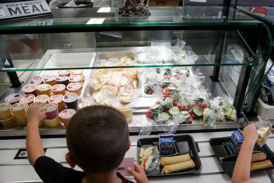 Students pick out items for lunch at Wea Ridge Elementary School, Thursday, Oct. 14, 2021 in Lafayette.