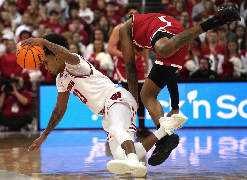 Maryland guard DeShawn Harris-Smith fouls Wisconsin guard Chucky Hepburn during the first half of their game Tuesday at the Kohl Center in Madison.



Mark Hoffman/Milwaukee Journal Sentinel