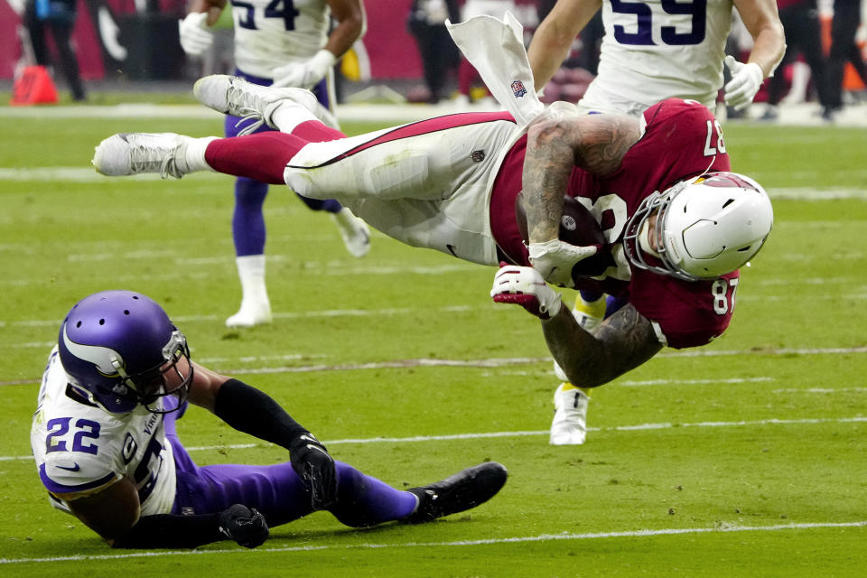 Minnesota Vikings free safety Harrison Smith (22) upends Arizona Cardinals tight end Maxx Williams (87) during the second half of an NFL football game, Sunday, Sept. 19, 2021, in Glendale, Ariz. (AP Photo/Rick Scuteri)
