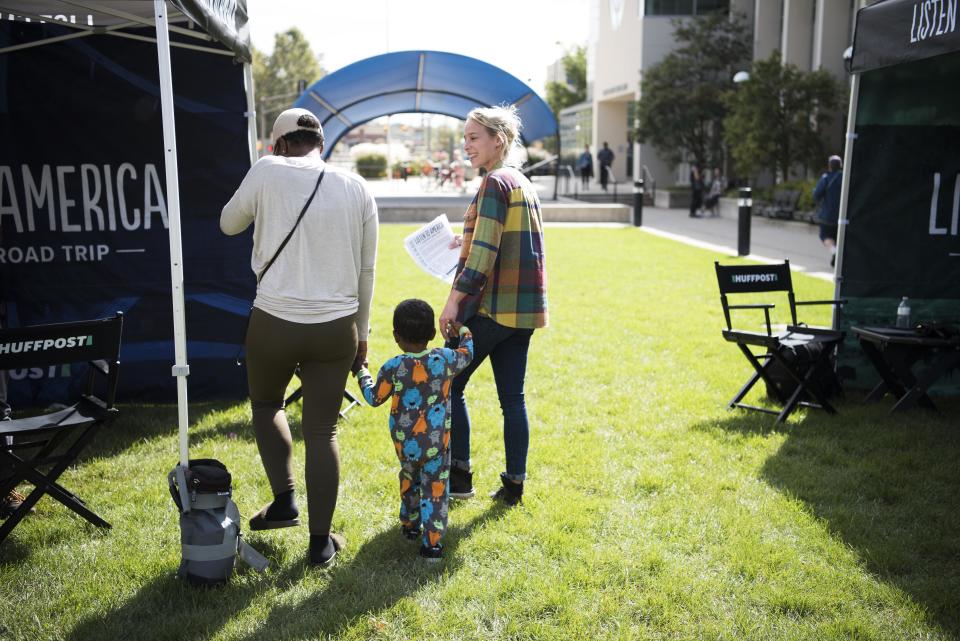 Alanna Vagianos walks Janora Hutt and her son TJ to the tent for a video interview.