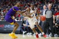 Cincinnati's Keith Williams (2) drives against East Carolina's J.J. Miles, left, during the first half of an NCAA college basketball game, Sunday, Jan. 19, 2020, in Cincinnati. (AP Photo/John Minchillo)