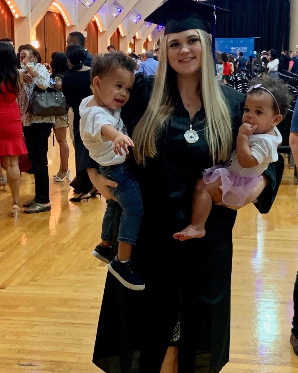 A'Lea Smith, 27, graduating  this fall as a Registered Nurse from Galen College of Nursing, holding her children, Jet, 2 (left), and Jose, 1.