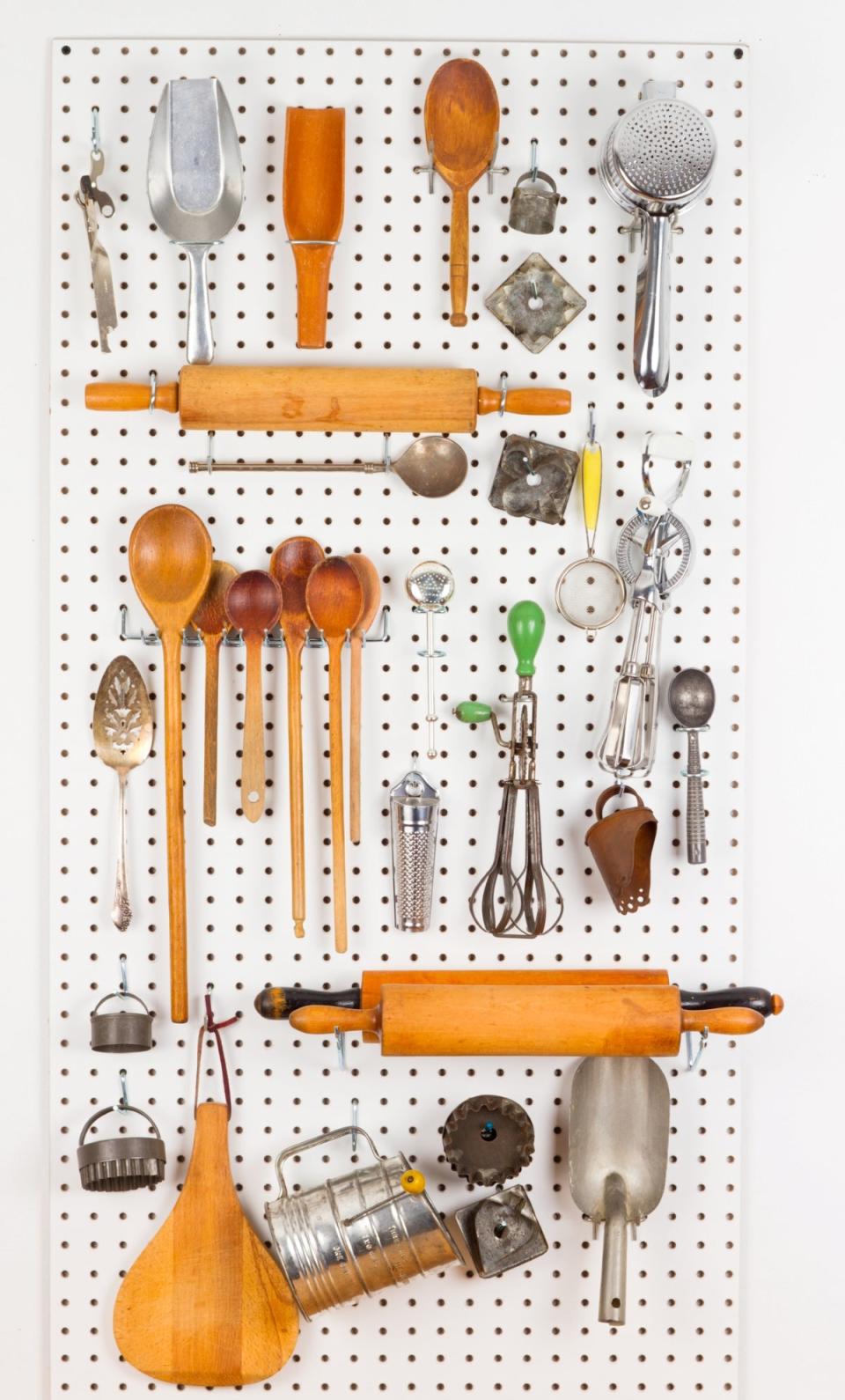 kitchen storage hacks - cooking gadgets on pegboard