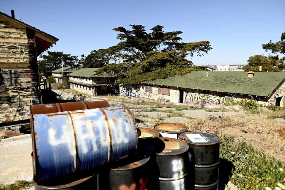 FILE - Rusted barrels rest outside barracks at Fort Ord on Wednesday, April 28, 2021, in Fort Ord, Calif. In a Nov. 4, 2022 letter to Rep. Katie Porter, D-Calif., the director of the CDC’s Agency for Toxic Substances and Disease Registry, Patrick Breysse, wrote that “there are sufficient data and scientific reasons for ATSDR to re-evaluate health risks related to historical drinking water exposures at Fort Ord.” (AP Photo/Noah Berger, File)